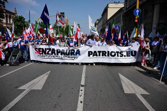 People march during a rally organized by the Patriots for Europe group (PfE) at the European Parliament and titled “Without Fear: in Europe, masters in our own home,” in Milan on April 18, 2026. (Photo by PIERO CRUCIATTI / AFP)