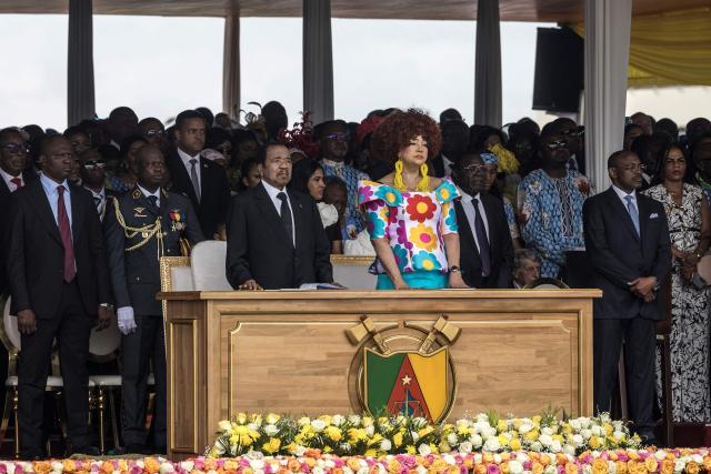 Cameroon's President Paul Biya (CL) and Cameroon's First Lady Chantal Biya (CR) attend the Holy Mass lead  by Pope Leo XIV at the Yaounde Ville Airport in Yaounde on the sixth day of an 11-day apostolic journey to Africa, on April 18, 2026. (Photo by PATRICK MEINHARDT / AFP)