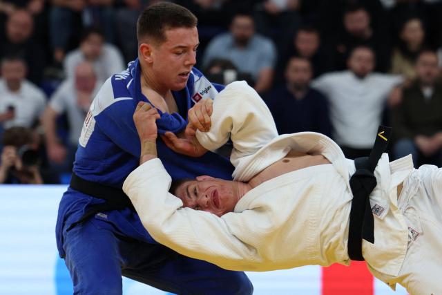 Finland's Eetu Ihanamaki (white) and Serbia's Mihajlo Simin compete in the men's under 81 kg category bronze medal bout at the Judo European Senior Championships 2026 in Tbilisi on April 18, 2026. (Photo by Giorgi ARJEVANIDZE / AFP)