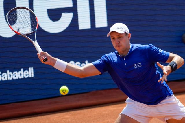 Serbia's Hamad Medjedovic returns the ball to Russia's Andrey Rublev during their men’s singles semi-final match at the ATP Barcelona Open "Conde de Godo" tennis tournament in Barcelona, on April 18, 2026. (Photo by Manaure Quintero / AFP)