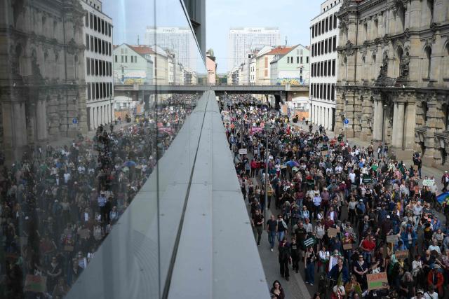 Activists and supporters of Fridays for Future, Campact and others take part in a demonstration against the German government's energy policy, on April 18, 2026 in Berlin. Activists call for faster expansion of solar and wind energy, rapid development of distribution grids, storage and digitalization, a strong European clean energy industry, lower electricity taxes and cheaper power for heat pumps, as well as social support and tenant protection to ensure affordable, climate-friendly heating. (Photo by RALF HIRSCHBERGER / AFP)