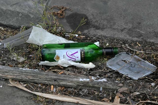 A glass bottle is pictured during an investigation into an arson attack, beside the business "Jewish futures" in Hendon, north London on April 18, 2026. Counter-terrorism police are investigating an arson attack that targeted a business in an area with a large Jewish community in northwest London, the British capital's police said April 18, 2026, following several similar incidents in recent weeks. (Photo by JUSTIN TALLIS / AFP)