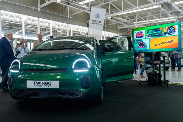 Visitors look at Renault Twingo E-Tech car at the Retro Auto Moto Valladolid Show during the celebration of Renault FASA's 75th anniversary in Valladolid, Spain on April 18, 2026. (Photo by CESAR MANSO / AFP)