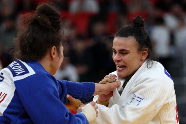 Greece's Elisavet Teltsidou (white) and Russia's Madina Taimazova compete in the women's under 70 kg category bronze medal bout at the Judo European Senior Championships 2026 in Tbilisi on April 18, 2026. (Photo by Giorgi ARJEVANIDZE / AFP)