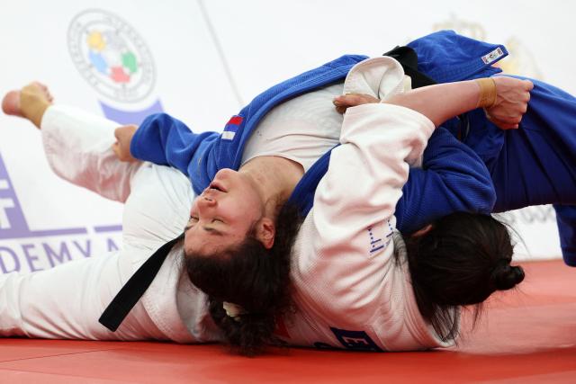 Greece's Elisavet Teltsidou (white) and Russia's Madina Taimazova compete in the women's under 70 kg category bronze medal bout at the Judo European Senior Championships 2026 in Tbilisi on April 18, 2026. (Photo by Giorgi ARJEVANIDZE / AFP)