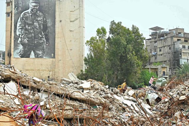 A resident inspects the rubble of destroyed buildings upon his arrival back to the southern Lebanese city of Nabatieh on April 18, 2026. Lebanese President Joseph Aoun said on April 17 that his country was on the verge of a "new phase" of "permanent agreements", after the 10-day ceasefire in the Israel-Hezbollah war went into force. Lebanon was drawn into the Middle East conflict on March 2 when Tehran-backed Hezbollah attacked Israel to avenge the death of Iranian supreme leader Ali Khamenei. (Photo by FADEL itani / AFP)