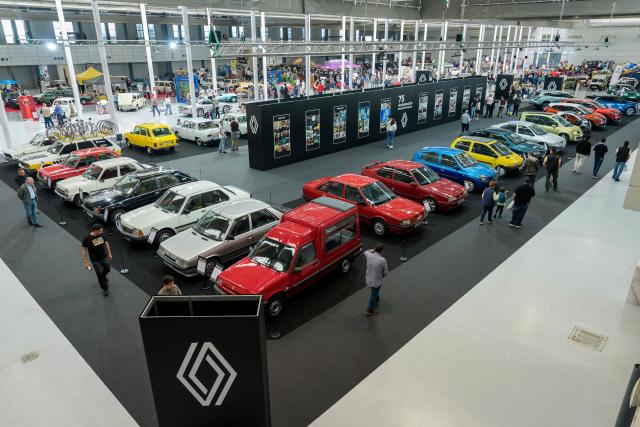 Visitors look at Renault cars at the Retro Auto Moto Valladolid Show during the celebration of Renault FASA's 75th anniversary in Valladolid, Spain on April 18, 2026. (Photo by CESAR MANSO / AFP)