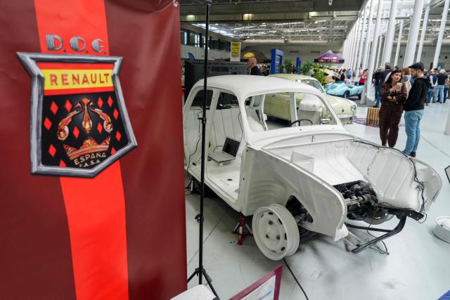 Visitors look at Renault cars at the Retro Auto Moto Valladolid Show during the celebration of Renault FASA's 75th anniversary in Valladolid, Spain on April 18, 2026. (Photo by CESAR MANSO / AFP)