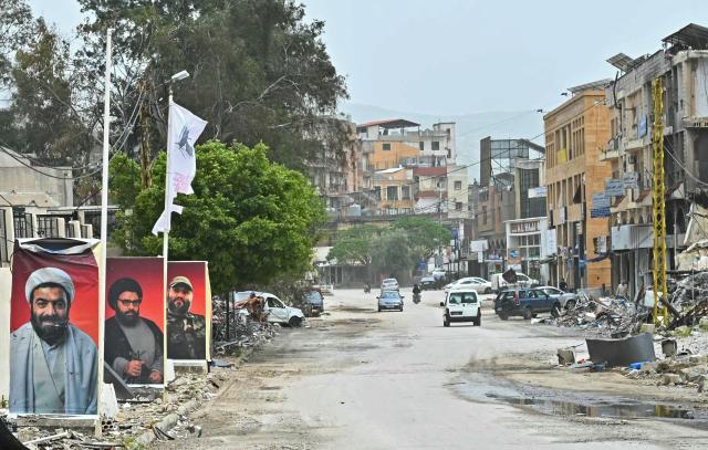 Displaced residents drive past damaged buildings as they return back to the southern Lebanese city of Nabatieh on April 18, 2026. Lebanese President Joseph Aoun said on April 17 that his country was on the verge of a "new phase" of "permanent agreements", after the 10-day ceasefire in the Israel-Hezbollah war went into force. Lebanon was drawn into the Middle East conflict on March 2 when Tehran-backed Hezbollah attacked Israel to avenge the death of Iranian supreme leader Ali Khamenei. (Photo by FADEL itani / AFP)