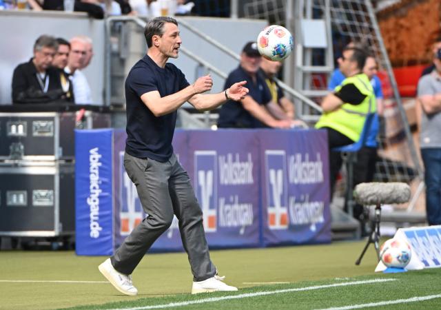 Dortmund's Croatian head coach Niko Kovac eyes a ball during the German first division Bundesliga football match between TSG 1899 Hoffenheim and BVB Borussia Dortmund in Sinsheim, southwestern Germany on April 18, 2026. (Photo by Uli Deck / AFP) / DFL REGULATIONS PROHIBIT ANY USE OF PHOTOGRAPHS AS IMAGE SEQUENCES AND/OR QUASI-VIDEO