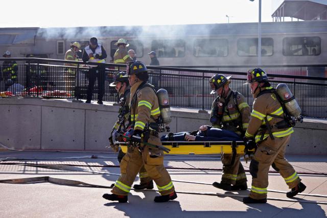 Firefighters take part in emergency response drills at the rail station near MetLife Stadium ahead of the 2026 FIFA World Cup in East Rutherford, New Jersey, on April 18, 2026. (Photo by Leonardo MUNOZ / AFP)