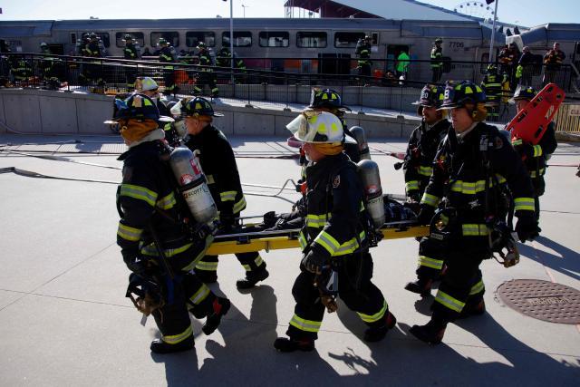Firefighters take part in emergency response drills at the rail station near MetLife Stadium ahead of the 2026 FIFA World Cup in East Rutherford, New Jersey, on April 18, 2026. (Photo by Leonardo MUNOZ / AFP)