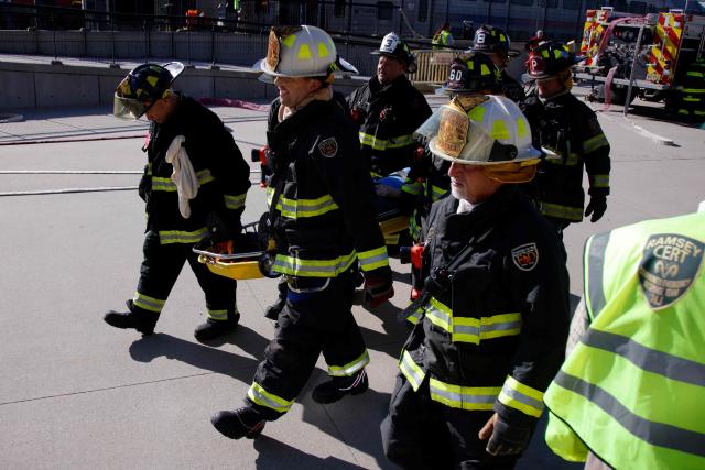 Firefighters take part in emergency response drills at the rail station near MetLife Stadium ahead of the 2026 FIFA World Cup in East Rutherford, New Jersey, on April 18, 2026. (Photo by Leonardo MUNOZ / AFP)