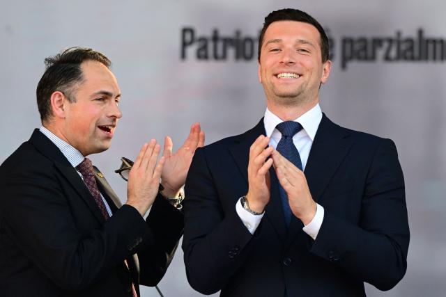 France’s far-right Rassemblement National (RN) party President Jordan Bardella stands on stage at the end of a rally organized by the Patriots for Europe group (PfE) at the European Parliament and titled “Without Fear: in Europe, masters in our own home,” in Milan on April 18, 2026. (Photo by PIERO CRUCIATTI / AFP)