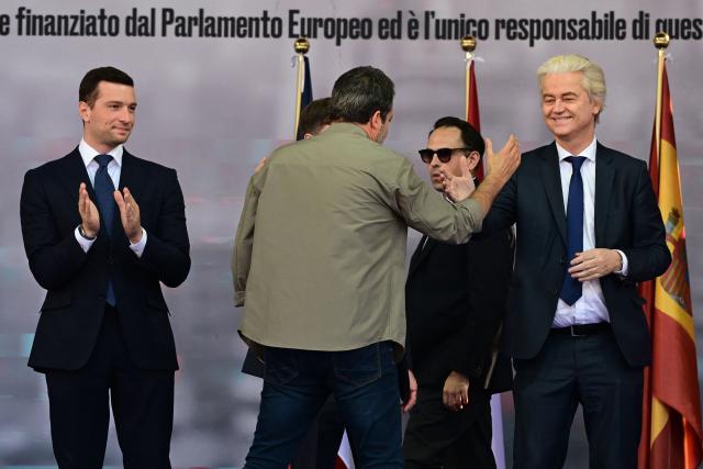 Italy's Deputy Prime Minister and leader of the Lega party, Matteo Salvini shakes hands with Dutch politician and leader of the Netherlands' far-right Party for Freedom (PVV) Geert Wilders as France’s far-right Rassemblement National (RN) party President Jordan Bardella (L) looks on at the end of a rally organized by the Patriots for Europe group (PfE) at the European Parliament and titled “Without Fear: in Europe, masters in our own home,” in Milan on April 18, 2026. (Photo by PIERO CRUCIATTI / AFP)