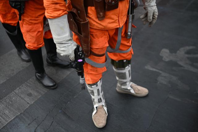 Fans wearing costumes from the Star Wars films take part in the Desfile de las Galaxias 2026 in Santiago on April 18, 2026. (Photo by RODRIGO ARANGUA / AFP)