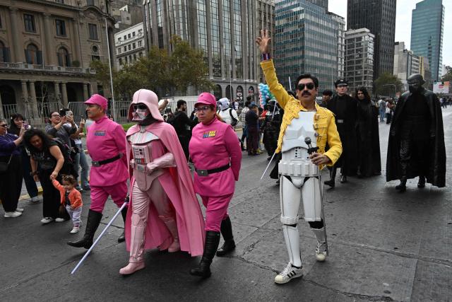 Fans wearing costumes from the Star Wars films take part in the Desfile de las Galaxias 2026 in Santiago on April 18, 2026. (Photo by RODRIGO ARANGUA / AFP)