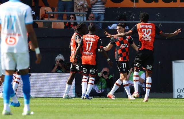 Lorient's Greek midfilder Panos Katseris #77 (2nd R) celebrates after scoring his team first goal during the French L1 football match between FC Lorient and Olympique de Marseille at the Moustoir stadium in Lorient, western France on April 18, 2026. (Photo by Fred TANNEAU / AFP)