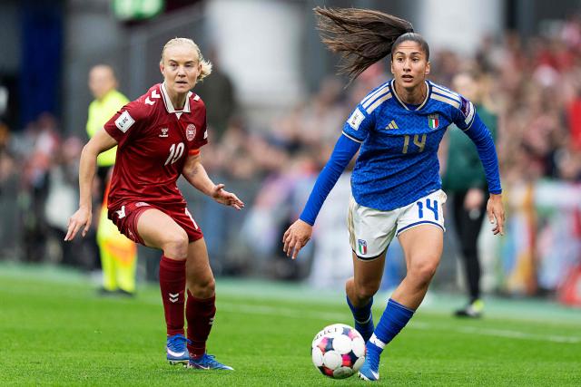 Denmark's forward #10 Pernille Harder (L) and Italy's forward #14 Chiara Beccari vie for the ball during the Women's FIFA world cup league A, group A1, qualifier football match between Denmark and Italy at Parken in Copenhagen, Denmark, on April 18, 2026. (Photo by Claus Bech / Ritzau Scanpix / AFP) / Denmark OUT