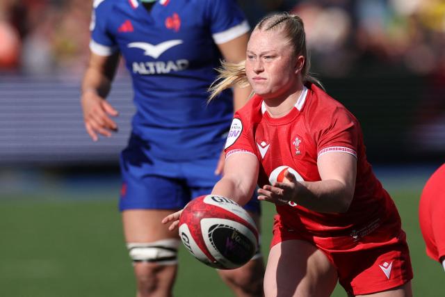 Wales' scrum-half Seren Lockwood passes the ball during the Women's Six Nations international rugby union match between Wales and France  at the Cardiff Arms Park, in Cardiff, southern Wales on April 18, 2026. (Photo by Adrian Dennis / AFP)