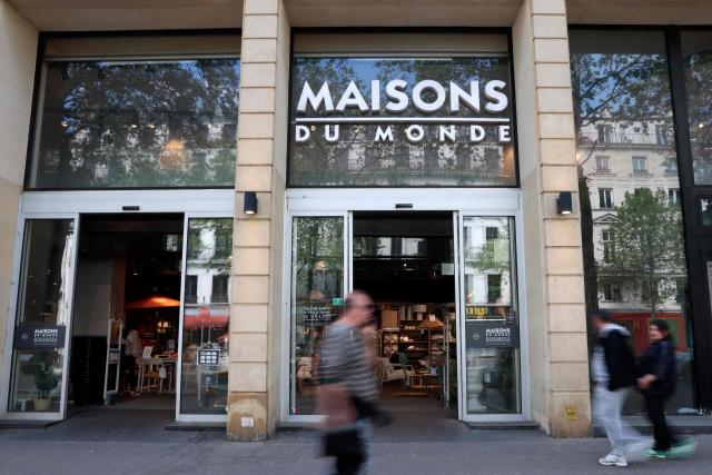 Pedestrians walk past a "Maisons du Monde" store in Paris on April 18, 2026. (Photo by ALAIN JOCARD / AFP)