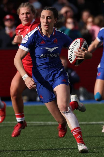 France's wing Anais Grando runs in a try during the Women's Six Nations international rugby union match between Wales and France  at the Cardiff Arms Park, in Cardiff, southern Wales on April 18, 2026. (Photo by Adrian Dennis / AFP)