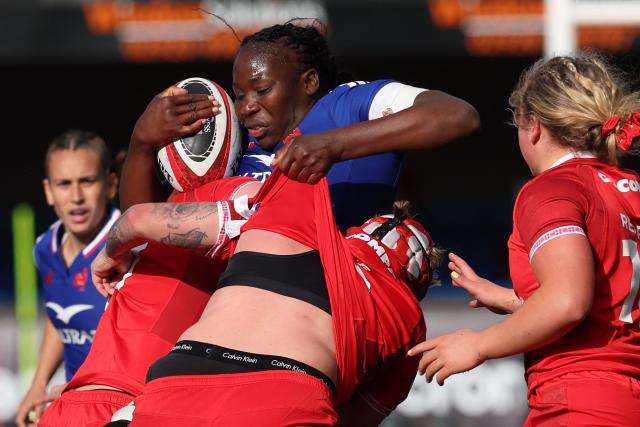 France's lock Madoussou Fall is tackled during the Women's Six Nations international rugby union match between Wales and France  at the Cardiff Arms Park, in Cardiff, southern Wales on April 18, 2026. (Photo by Adrian Dennis / AFP)
