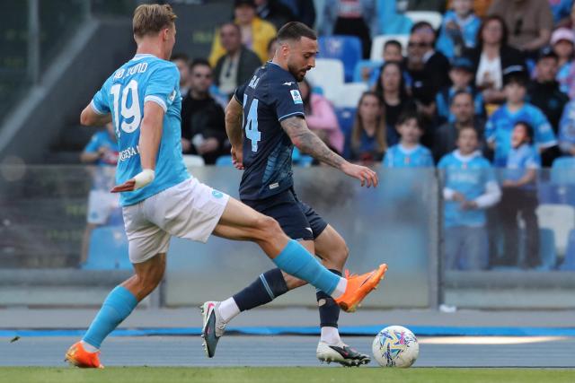 Napoli's Danish forward #19 Rasmus Hojlund fights for the ball with Lazio's Spanish defender #34 Mario Gila Fuentes during the Italian Serie A football match between Napoli and Lazio at the Diego Armando Maradona stadium in Naples on April 18, 2026. (Photo by Carlo Hermann / AFP)