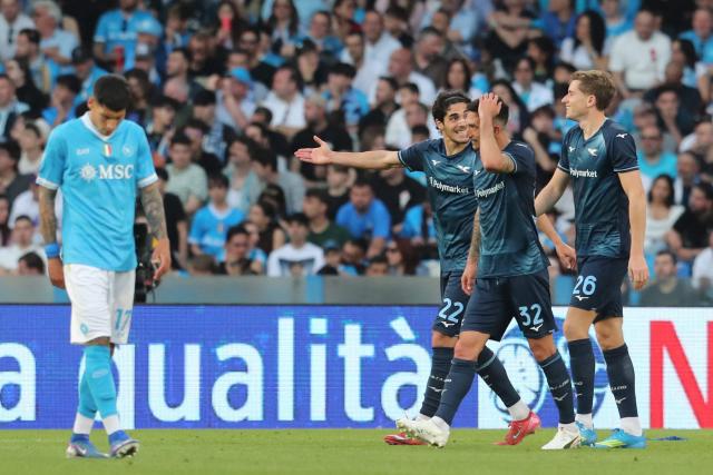 Lazio's Croatian midfielder #26 Toma Basic celebrates scoring his team's second goal with Lazio's Italian midfielder #32 Danilo Cataldi and Lazio's Italian forward #22 Matteo Cancellieri during the Italian Serie A football match between Napoli and Lazio at the Diego Armando Maradona stadium in Naples on April 18, 2026. (Photo by Carlo Hermann / AFP)