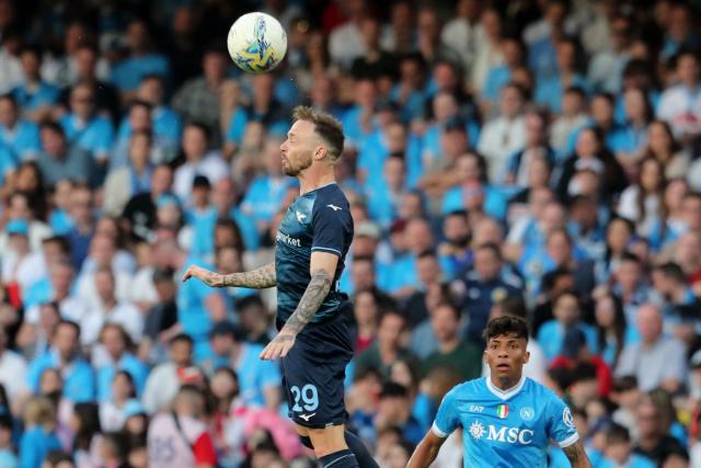 Lazio's Italian midfielder #29 Manuel Lazzari heads the ball during the Italian Serie A football match between Napoli and Lazio at the Diego Armando Maradona stadium in Naples on April 18, 2026. (Photo by Carlo Hermann / AFP)