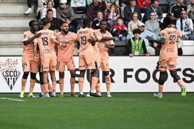 Le Havre's Moroccan midfielder #17 Sofiane Boufal (4th L) celebrates with team mates after scoring a goal during the French L1 football match between SCO Angers and Le Havre AC at the Stade Raymond-Kopa in Angers, western France on April 18, 2026. (Photo by Sebastien Salom-Gomis / AFP)