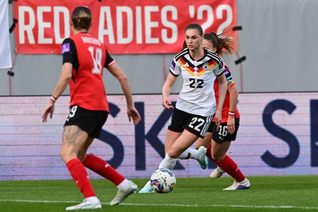 Germany's midfielder #22 Jule Brand plays the ball during the Women's FIFA world cup league A, group A4, qualifier football match between Austria and Germany at Josko Arena in Ried, Austria, on April 18, 2026. (Photo by Reinhard EISENBAUER / APA / AFP) / Austria OUT