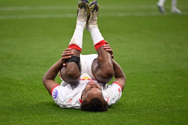 Leipzig's German midfielder #20 Assan Ouedraogo reacts injured during the German first division Bundesliga football match between Eintracht Frankfurt and RB Leipzig in Frankfurt am Main, western Germany, on April 18, 2026. (Photo by Kirill KUDRYAVTSEV / AFP) / DFL REGULATIONS PROHIBIT ANY USE OF PHOTOGRAPHS AS IMAGE SEQUENCES AND/OR QUASI-VIDEO