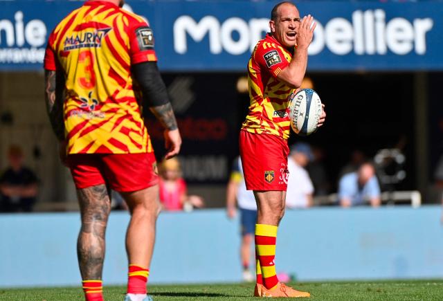 Perpignan's Argentinian fly-half Benjamin Urdapilleta (R) reacts during the French Top14 rugby union match between Montpellier Herault Rugby and USA Perpignan at the Septeo Stadium in Montpellier, southern France on April 18, 2026. (Photo by Sylvain THOMAS / AFP)