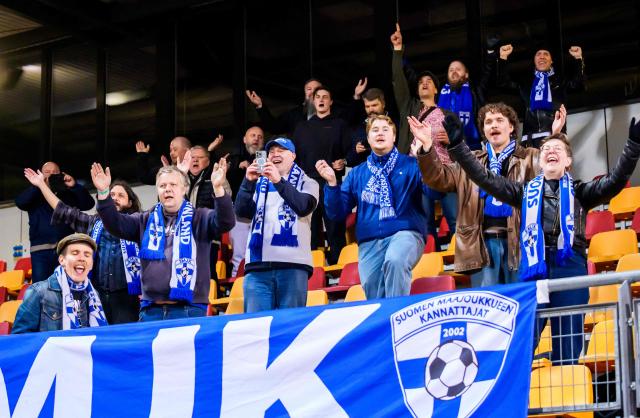 Finnish fans celebrate after the Women's FIFA world cup league B, group B3, qualifier football match between Latvia and Finland at Daugava in Riga, Latvia, on April 18, 2026. (Photo by Gints Ivuskans / AFP)
