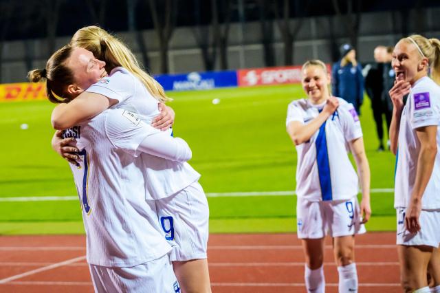 Finland's forward #17 Sanni Franssi (L) celebrates with a teammate after the Women's FIFA world cup league B, group B3, qualifier football match between Latvia and Finland at Daugava in Riga, Latvia, on April 18, 2026. (Photo by Gints Ivuskans / AFP)