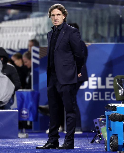 France's head coach Laurent Bonadei reacts during the women's FIFA world cup league A, group 2, qualifying football match between France and The Netherlands at the Stade de l'Abbe-Deschamps in Auxerre, central France on April 18, 2026. (Photo by FRANCK FIFE / AFP)