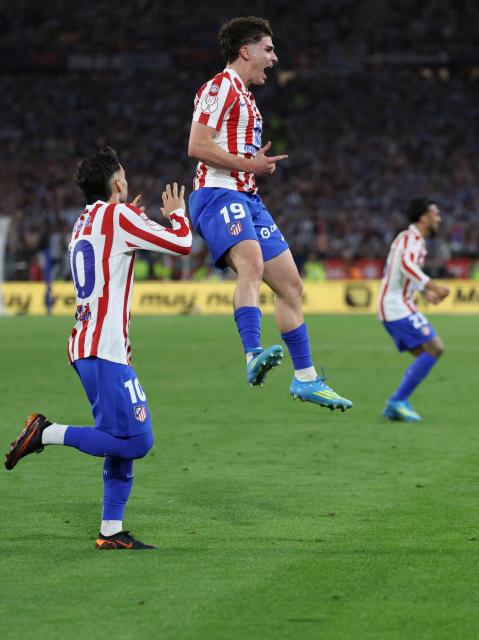 Atletico Madrid's Argentine forward #19 Julian Alvarez celebrates scoring his team's second goal during the Copa del Rey (King's Cup) final football match between Club Atletico de Madrid and Real Sociedad at La Cartuja stadium in Seville on April 18, 2026. (Photo by Thomas COEX / AFP)