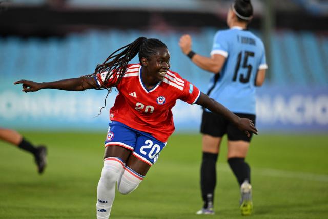 Chile's midfielder #20 Mary Valencia celebrates scoring her team's first goal during the CONMEBOL Nations League Women football match between Uruguay and Chile at the Centenario stadium in Montevideo, on April 18, 2026. (Photo by Eitan ABRAMOVICH / AFP)