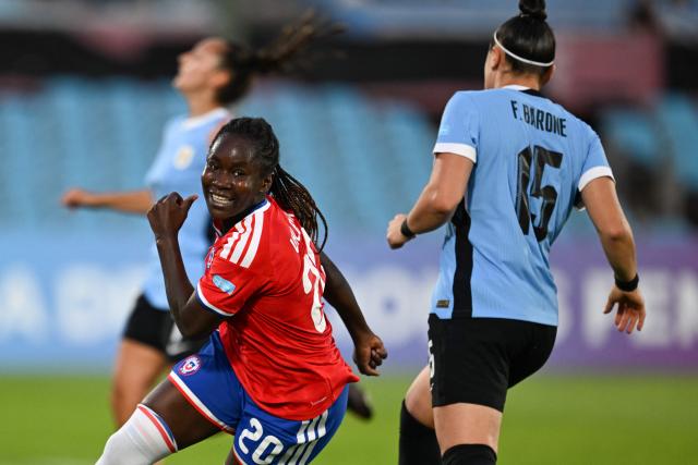 Chile's midfielder #20 Mary Valencia celebrates scoring her team's first goal during the CONMEBOL Nations League Women football match between Uruguay and Chile at the Centenario stadium in Montevideo, on April 18, 2026. (Photo by Eitan ABRAMOVICH / AFP)