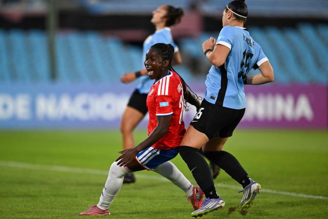 Chile's midfielder #20 Mary Valencia celebrates scoring her team's first goal during the CONMEBOL Nations League Women football match between Uruguay and Chile at the Centenario stadium in Montevideo, on April 18, 2026. (Photo by Eitan ABRAMOVICH / AFP)