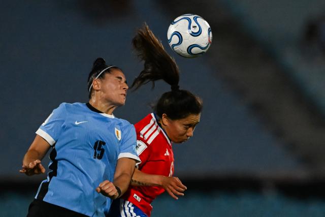 Uruguay's defender #15 Fatima Barone and Chile's midfielder #06 Yastin Jimenez fight for the ball during the CONMEBOL Nations League Women football match between Uruguay and Chile at the Centenario stadium in Montevideo, on April 18, 2026. (Photo by Eitan ABRAMOVICH / AFP)
