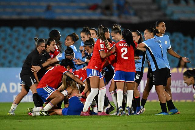 Uruguay and Chile players clash during the CONMEBOL Nations League Women football match between Uruguay and Chile at the Centenario stadium in Montevideo, on April 18, 2026. (Photo by Eitan ABRAMOVICH / AFP)