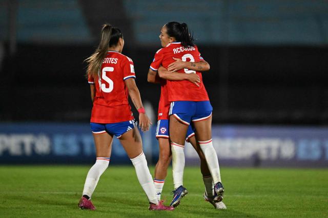 Chile's forward #07 Vaitiare Pardo (behind) celebrates scoring her team's third goal with teammate forward #09 Sonya Keefe (R) during the CONMEBOL Nations League Women football match between Uruguay and Chile at the Centenario stadium in Montevideo, on April 18, 2026. (Photo by Eitan ABRAMOVICH / AFP)