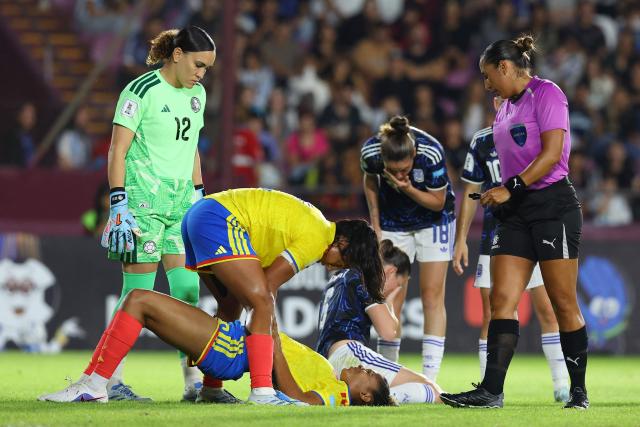 Colombia's defender #16 Jorelyn Carabali (bootom) lies on the ground after a clash during the CONMEBOL Nations League Women football match between Argentina and Colombia, at the Ciudad de Lanus stadium in Lanus, Buenos Aires province, Argentina, on April 18, 2026. (Photo by Alejandro PAGNI / AFP)