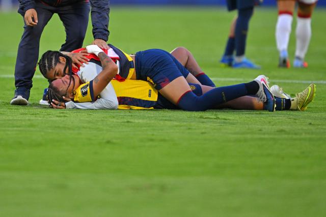 Ecuador's forward #23 Lia Rodriguez (top) and defender #04 Justine Cuadra (bottom) celebrate after winning the CONMEBOL Nations League Women football match between Ecuador and Peru at the Olimpico Atahualpa stadium in Quito, on April 18, 2026. (Photo by Rodrigo BUENDIA / AFP)