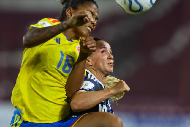 Argentina's midfielder #16 Evelyn Dominguez (R) fights for the ball with Colombia's defender #16 Jorelyn Carabali (L) during the CONMEBOL Nations League Women football match between Argentina and Colombia, at the Ciudad de Lanus stadium in Lanus, Buenos Aires province, Argentina, on April 18, 2026. (Photo by Alejandro PAGNI / AFP)