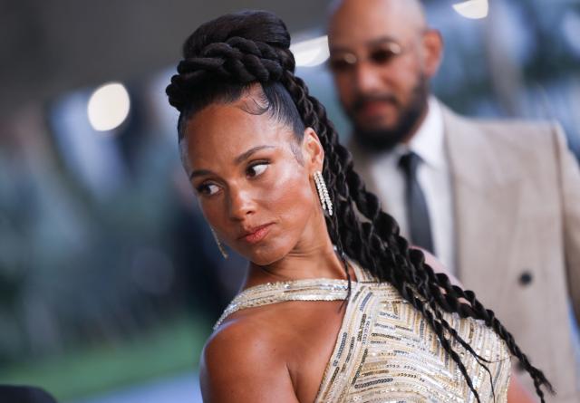 US singer-songwriter Alicia Keys and her husband producer Swizz Beatz attend the 2026 AFI Life Achievement Award at the Dolby Theatre in Hollywood, California on April 18, 2026. US actor Eddie Murphy is the recipient of the 2026 AFI Life Achievement Award. (Photo by Etienne LAURENT / AFP)