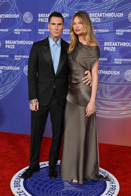 US singer Adam Levine and his wife Namibian model Behati Prinsloo attend the 12th Breakthrough Prize Ceremony at Barker Hangar in Santa Monica, California on April 18, 2026. (Photo by Lisa O'CONNOR / AFP)