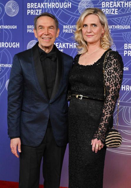 US artist Jeff Koons and his wife Justine Wheeler Koons attend the 12th Breakthrough Prize Ceremony at Barker Hangar in Santa Monica, California on April 18, 2026. (Photo by Lisa O'CONNOR / AFP)
